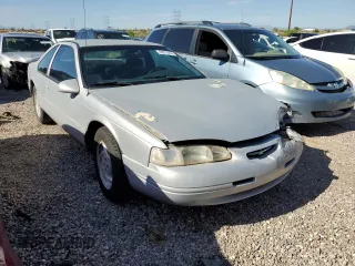 1997 Ford Thunderbird LX z VIN 1FALP62W2VH171912, wystawiony jako Copart lot #65073454 z przebiegiem 179 439 mil mil oraz Szkoda całkowita • Salvage title. Historia ofert i sprzedaży dostępna na DreamBid. Obrazek 4.