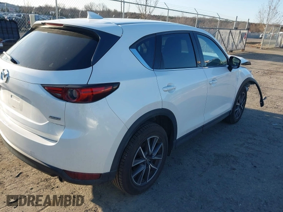 2018 Mazda CX-5 S Premium with VIN JM3KFBDM8J1419006, listed as a IAAI auction lot 41498658 with 123,622 mi miles and . Bid and sale history available at DreamBid. Image 4.