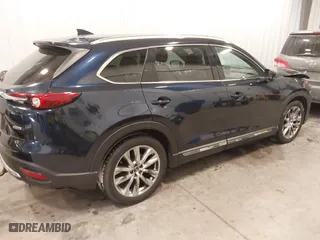2016 Mazda CX-9 Grand Touring with VIN JM3TCBDY9G0109770, listed as a IAAI auction lot 41551085 with 131,812 mi miles. Bid and sale history available at carsss.com. Image 4.