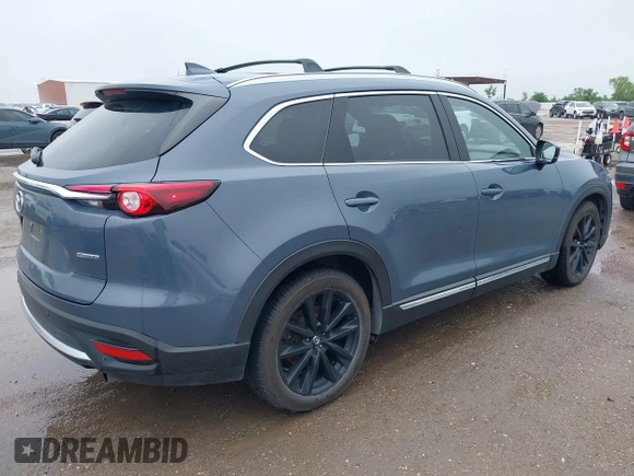 2021 Mazda CX-9 Grand Touring with VIN JM3TCBDY9M0534966, listed as a IAAI auction lot 42166071 with 77,817 mi miles and . Bid and sale history available at DreamBid. Image 4.