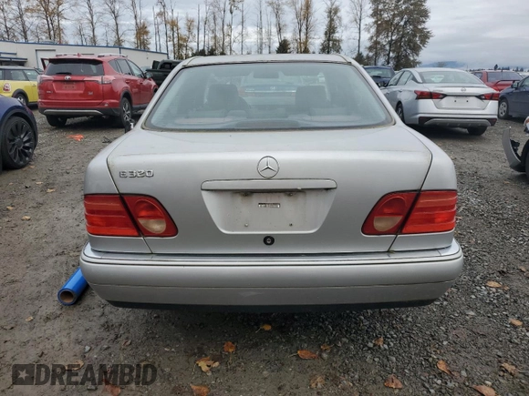 1999 Mercedes-Benz E-Class with VIN WDBJF65H5XA906877, listed as a Copart auction lot 76156014 with 141,956 mi miles and Clean Title. Bid and sale history available at carsss.com. Image 6.