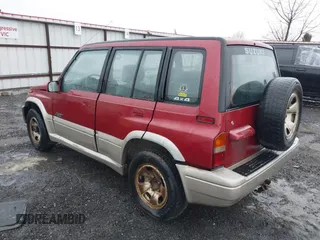 1996 Suzuki Sidekick z VIN JS3TD21V0T4107927, wystawiony jako IAAI lot #41249522 z przebiegiem 225 665 mil mil oraz . Historia ofert i sprzedaży dostępna na DreamBid. Obrazek 3.