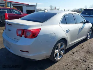 2014 Chevrolet Malibu LTZ with VIN 1G11J5SX0EF289841, listed as a IAAI auction lot 41669908 with 233,599 mi miles. Bid and sale history available at carsss.com. Image 4.