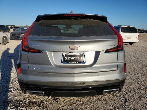 2024 Cadillac XT4 FWD Premium Luxury with VIN 1GYFZCR47RF213944, listed as a Copart auction lot 87674675 with 1,606 mi miles and Salvage title. Bid and sale history available at DreamBid. Image 6.