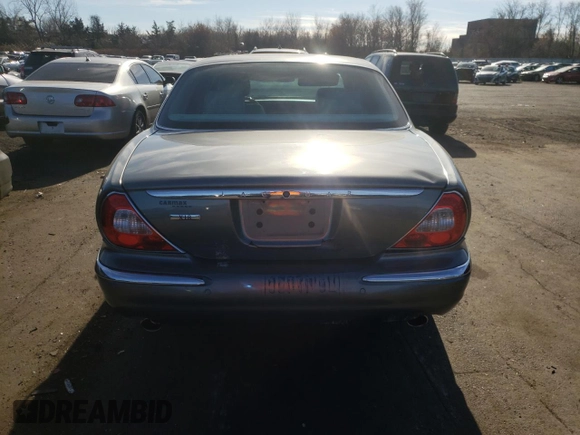 2004 Jaguar XJ with VIN SAJWA71C74SG34056, listed as a Copart auction lot 80083014 with 0 mi miles and Salvage Title. Bid and sale history available at carsss.com. Image 6.