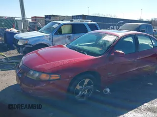2003 Pontiac Bonneville SLE z VIN 1G2HY52K534159881, wystawiony jako IAAI lot #41604988 z przebiegiem 227 097 mil mil oraz . Historia ofert i sprzedaży dostępna na DreamBid. Obrazek 6.
