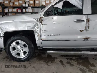 2017 Chevrolet Silverado 1500 LT with VIN 3GCUKREC2HG473554, listed as a IAAI auction lot 42220143 with 80,000 mi miles and . Bid and sale history available at DreamBid. Image 6.