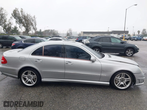 2003 Mercedes-Benz E-Class 5.5L AMG with VIN WDBUF76J93A351317, listed as a IAAI auction lot 41573446 with 144,119 mi miles. Bid and sale history available at carsss.com. Image 13.