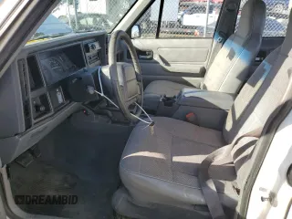 1996 Jeep Cherokee Sport with VIN 1J4FJ68S7TL325967, listed as a Copart auction lot 43654245 with 204,182 mi miles and Salvage Title. Bid and sale history available at carsss.com. Image 7.