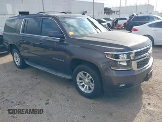 2015 Chevrolet Suburban LT z VIN 1GNSCJKCXFR175154, wystawiony jako IAAI lot #42280418 z przebiegiem 227 373 mil mil oraz . Historia ofert i sprzedaży dostępna na DreamBid. Obrazek 1.