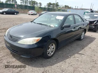 2004 Toyota Camry LE with VIN 4T1BF32KX4U077010, listed as a IAAI auction lot 42039297 with 113,742 mi miles. Bid and sale history available at carsss.com. Image 2.