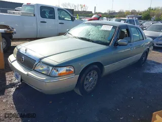 2005 Mercury Grand Marquis GS with VIN 2MEFM74W35X653175, listed as a IAAI auction lot 42005035 with 142,935 mi miles. Bid and sale history available at carsss.com. Image 2.
