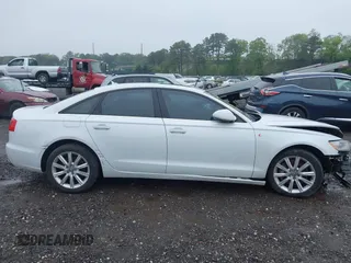 2014 Audi A6 Premium Plus z VIN WAUFGAFC4EN081900, wystawiony jako IAAI lot #42268150 z przebiegiem 150 238 mil mil oraz . Historia ofert i sprzedaży dostępna na DreamBid. Obrazek 13.