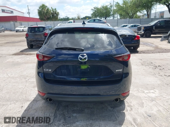 2017 Mazda CX-5 Touring with VIN JM3KFACL0H0227615, listed as a IAAI auction lot 42063618 with 72,291 mi miles. Bid and sale history available at carsss.com. Image 16.