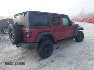2021 Jeep Wrangler Unlimited Willys with VIN 1C4HJXDN6MW815448, listed as a IAAI auction lot 41459304 with 52,474 mi miles and . Bid and sale history available at DreamBid. Image 4.