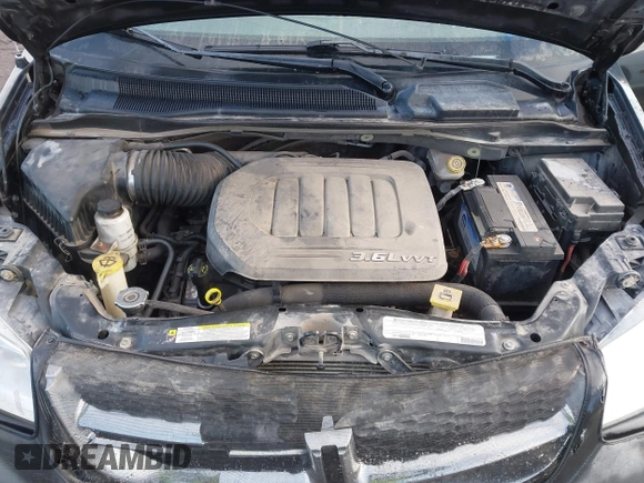 2012 Dodge Grand Caravan SXT with VIN 2C4RDGCG3CR318900, listed as a IAAI auction lot 41145958 with 201,117 mi miles and . Bid and sale history available at DreamBid. Image 10.