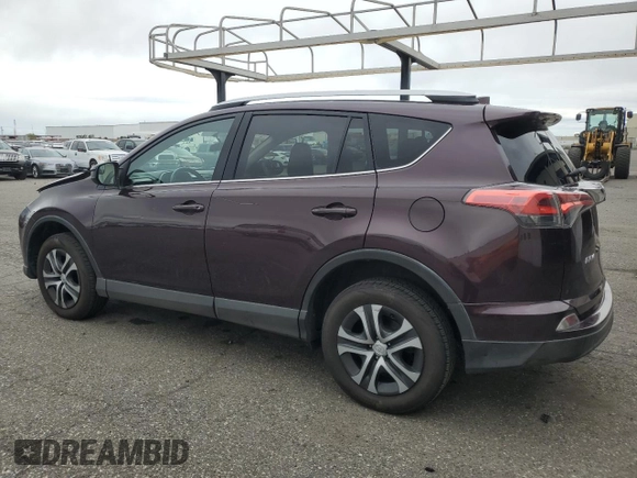 2016 Toyota RAV4 LE with VIN 2T3BFREV3GW490181, listed as a Copart auction lot 52457435 with 128,267 mi miles and Salvage Title. Bid and sale history available at DreamBid. Image 2.