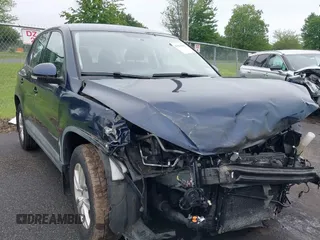 2014 Volkswagen Tiguan SEL with VIN WVGBV3AX5EW524798, listed as a IAAI auction lot 42534584 with 44,586 mi miles and . Bid and sale history available at DreamBid. Image 1.
