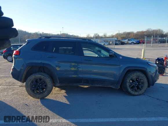 2015 Jeep Cherokee Trailhawk with VIN 1C4PJMBSXFW614416, listed as a IAAI auction lot 41033241 with 112,015 mi miles. Bid and sale history available at carsss.com. Image 14.