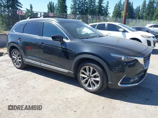 2018 Mazda CX-9 Grand Touring z VIN JM3TCBDY2J0237050, wystawiony jako IAAI lot #42457060 z przebiegiem 130 625 mil mil oraz . Historia ofert i sprzedaży dostępna na DreamBid. Obrazek 1.