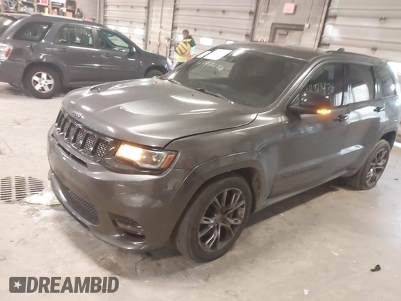 2018 Jeep Grand Cherokee SRT z VIN 1C4RJFDJ6JC432683, wystawiony jako IAAI lot #41971436 z przebiegiem 113 078 mil mil oraz . Historia ofert i sprzedaży dostępna na DreamBid. Obrazek 2.