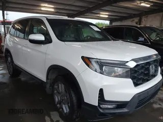 2023 Honda Passport EX-L z VIN 5FNYF8H5XPB023040, wystawiony jako IAAI lot #41904058 z przebiegiem 69 834 mil mil oraz . Historia ofert i sprzedaży dostępna na DreamBid. Obrazek 1.