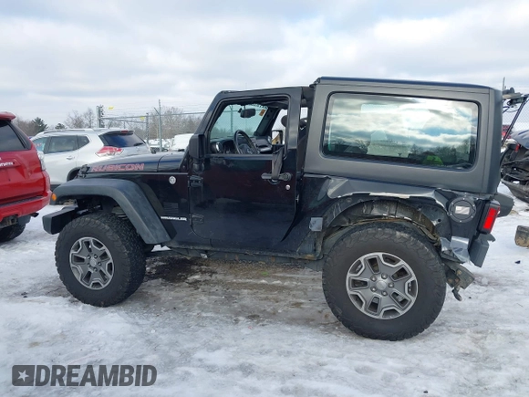 2013 Jeep Wrangler Rubicon 10th Anniversary with VIN 1C4BJWCG3DL591186, listed as a IAAI auction lot 41315969 with 54,984 mi miles and . Bid and sale history available at DreamBid. Image 15.