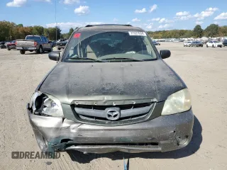 2002 Mazda Tribute LX with VIN 4F2YU09122KM62196, listed as a Copart auction lot 77327034 with 256,385 mi miles and Salvage Title. Bid and sale history available at carsss.com. Image 5.