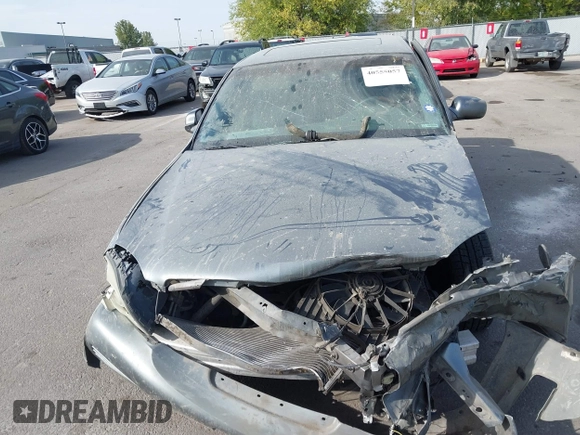 2004 Cadillac DeVille DHS z VIN 1G6KE57Y74U119605, wystawiony jako IAAI lot #40555057 z przebiegiem Nie podano mil oraz . Historia ofert i sprzedaży dostępna na DreamBid. Obrazek 12.