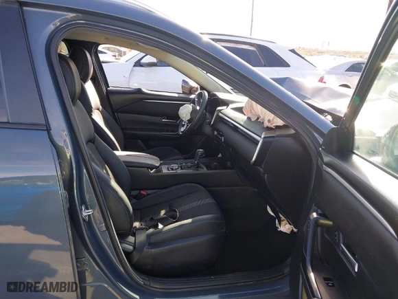 2024 Mazda CX-50 2.5 S Premium Package with VIN 7MMVABDMXRN163458, listed as a IAAI auction lot 41228299 with 8,771 mi miles. Bid and sale history available at carsss.com. Image 5.