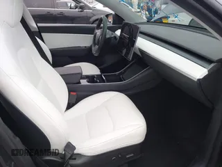 2021 Tesla Model Y Long Range with VIN 5YJYGDEEXMF092901, listed as a IAAI auction lot 42164866 with 61,240 mi miles and . Bid and sale history available at carsss.com. Image 5.