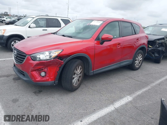 2016 Mazda CX-5 Touring with VIN JM3KE2CY3G0877185, listed as a IAAI auction lot 41729243 with 144,656 mi miles. Bid and sale history available at carsss.com. Image 2.