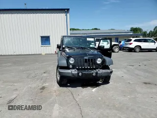 2014 Jeep Wrangler Sport with VIN 1C4AJWAG2EL113843, listed as a Copart auction lot 62771115 with 70,089 mi miles and Salvage title. Bid and sale history available at DreamBid. Image 14.