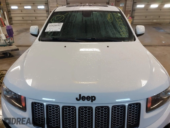 2015 Jeep Grand Cherokee Laredo with VIN 1C4RJFAG4FC660665, listed as a IAAI auction lot 41529532 with 124,099 mi miles. Bid and sale history available at carsss.com. Image 6.