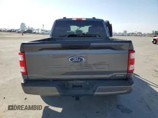2023 Ford F-150 XL with VIN 1FTEW1CP4PKD21685, listed as a Copart auction lot 54992615 with 27,252 mi miles and Salvage title. Bid and sale history available at DreamBid. Image 6.