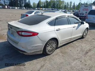 2016 Ford Fusion Titanium Hybrid with VIN 3FA6P0RU2GR357739, listed as a IAAI auction lot 42120441 with 151,201 mi miles. Bid and sale history available at carsss.com. Image 4.