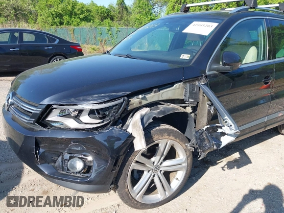 2014 Volkswagen Tiguan S z VIN WVGBV3AX5EW560393, wystawiony jako IAAI lot #42105203 z przebiegiem 102 001 mil mil oraz . Historia ofert i sprzedaży dostępna na DreamBid. Obrazek 6.