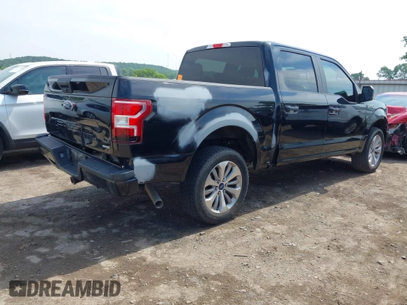 2018 Ford F-150 XL with VIN 1FTEW1EP1JKD05142, listed as a IAAI auction lot 42473177 with 99,079 mi miles and . Bid and sale history available at DreamBid. Image 4.