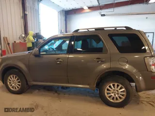 2010 Mercury Mariner Premier with VIN 4M2CN9HGXAKJ11983, listed as a IAAI auction lot 41512060 with 154,971 mi miles. Bid and sale history available at carsss.com. Image 14.