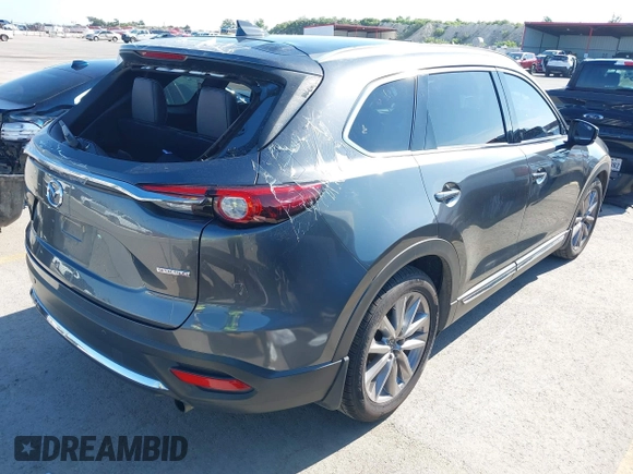 2020 Mazda CX-9 Grand Touring with VIN JM3TCADY1L0417651, listed as a IAAI auction lot 42334867 with 105,236 mi miles and . Bid and sale history available at DreamBid. Image 4.