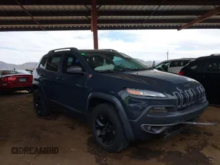 2016 Jeep Cherokee Trailhawk with VIN 1C4PJMBS1GW340475, listed as a IAAI auction lot 41735492 with 100,542 mi miles. Bid and sale history available at carsss.com. Image 1.