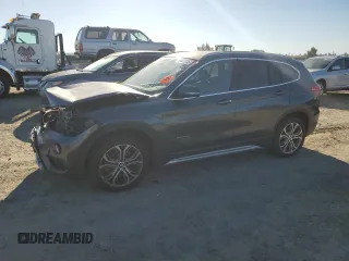 2017 BMW X1 sDrive28i with VIN WBXHU7C3XH5H36874, listed as a Copart auction lot 50607235 with 100,458 mi miles and Clean Title. Bid and sale history available at carsss.com. Image 1.