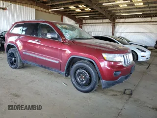 2013 Jeep Grand Cherokee Overland with VIN 1C4RJECT6DC526743, listed as a Copart auction lot 50203065 with 186,673 mi miles and Salvage Title. Bid and sale history available at DreamBid. Image 4.