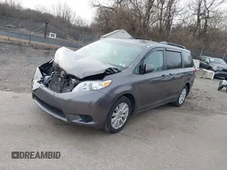 2014 Toyota Sienna LE with VIN 5TDJK3DC1ES087626, listed as a IAAI auction lot 41610813 with 142,311 mi miles and . Bid and sale history available at DreamBid. Image 2.