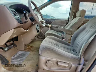 2000 Toyota Sienna LE with VIN 4T3ZF13C2YU218417, listed as a Copart auction lot 63328035 with 263,439 mi miles and Salvage title. Bid and sale history available at DreamBid. Image 7.