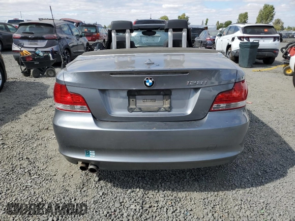 2009 BMW 1 Series 128i with VIN WBAUL73509VJ76763, listed as a Copart auction lot 66763214 with 83,954 mi miles and Salvage Title. Bid and sale history available at DreamBid. Image 6.