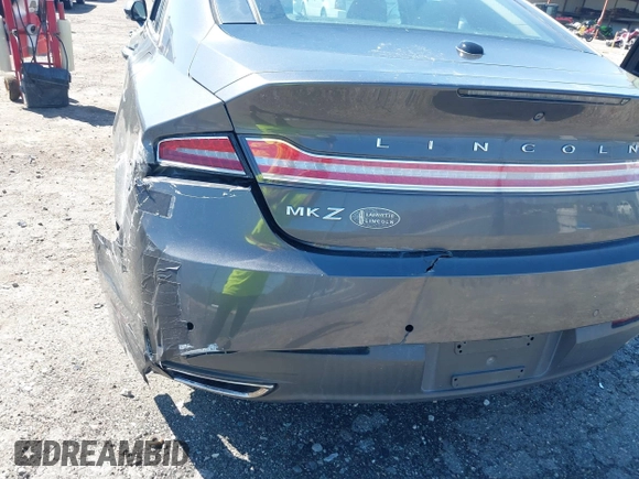 2016 Lincoln MKZ z VIN 3LN6L2G90GR632116, wystawiony jako IAAI lot #41836442 z przebiegiem 121 223 mil mil oraz . Historia ofert i sprzedaży dostępna na DreamBid. Obrazek 13.