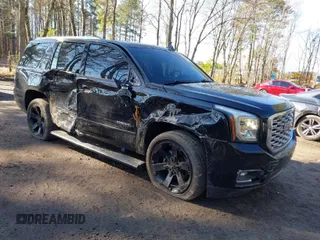 2018 GMC Yukon Denali with VIN 1GKS2CKJ8JR288331, listed as a IAAI auction lot 41674502 with 101,146 mi miles. Bid and sale history available at carsss.com. Image 1.