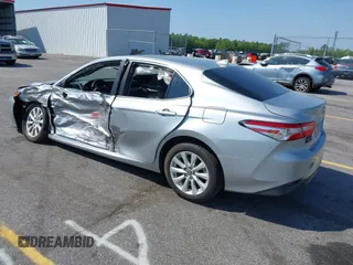 2020 Toyota Camry LE with VIN 4T1C11AK9LU341762, listed as a IAAI auction lot 42001577 with 84,991 mi miles and . Bid and sale history available at DreamBid. Image 3.