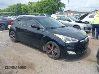 2013 Hyundai Veloster w/Black Int with VIN KMHTC6ADXDU084704, listed as a IAAI auction lot 42443297 with 111,587 mi miles and . Bid and sale history available at DreamBid. Image 1.